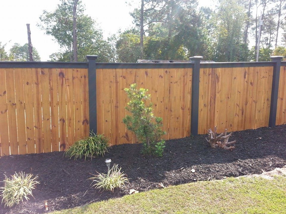 Wood Fence with Black Tops and Posts