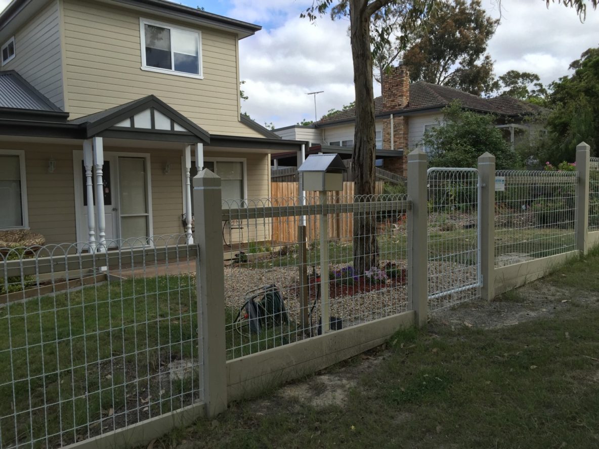 Woven Wire Fence with Wooden Posts